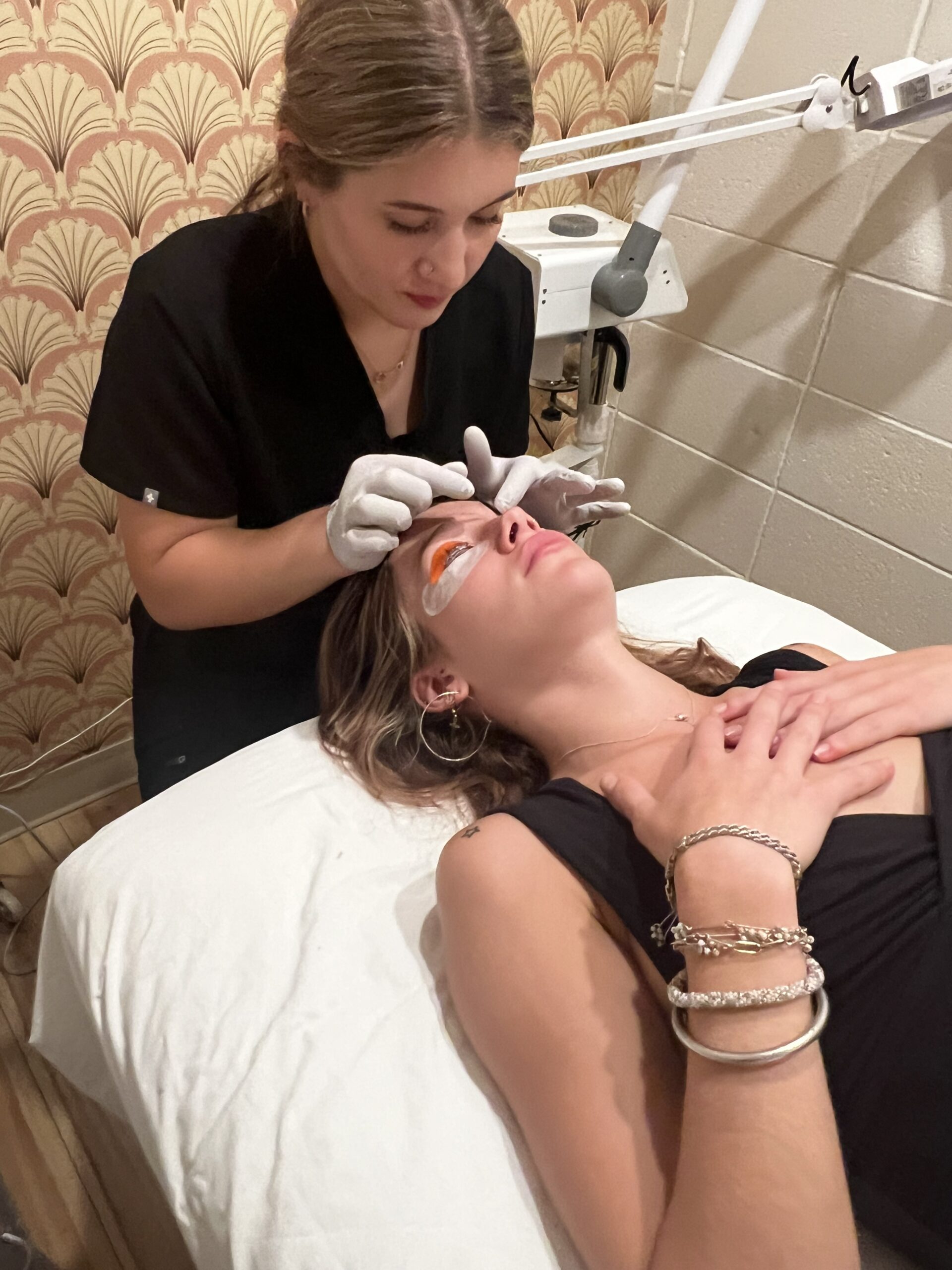 Isela performing a facial treatment at willow skincare, eugene OR