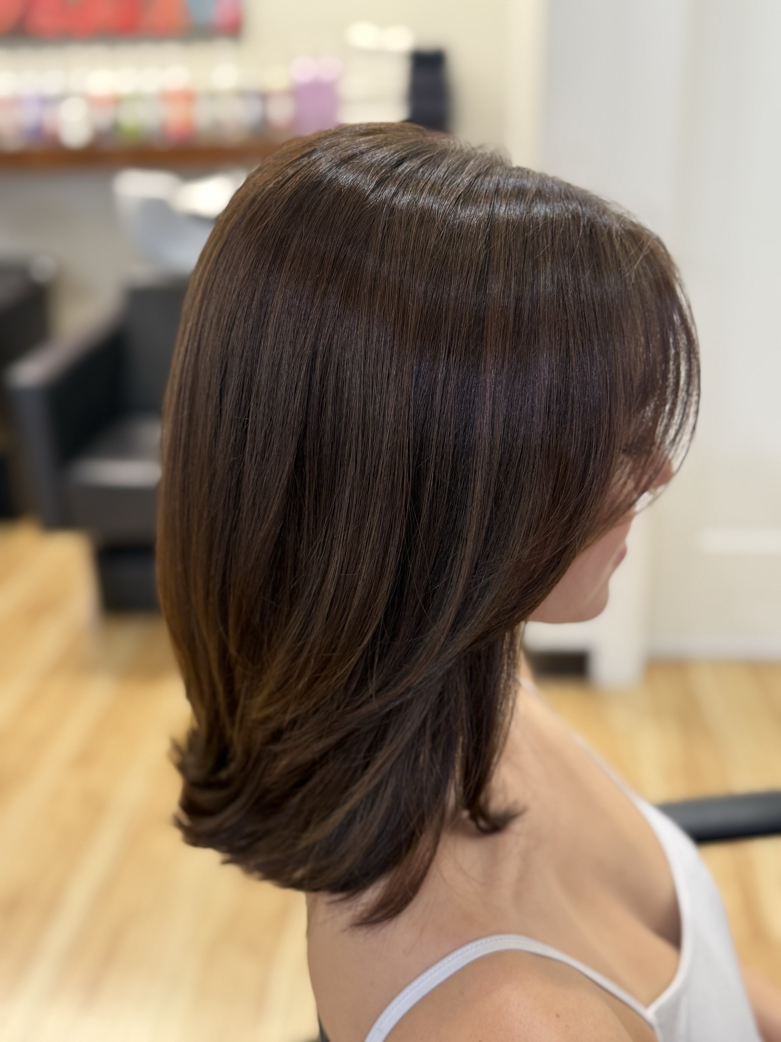 sleek shiny blowout result by a stylist at willow hair, eugene OR