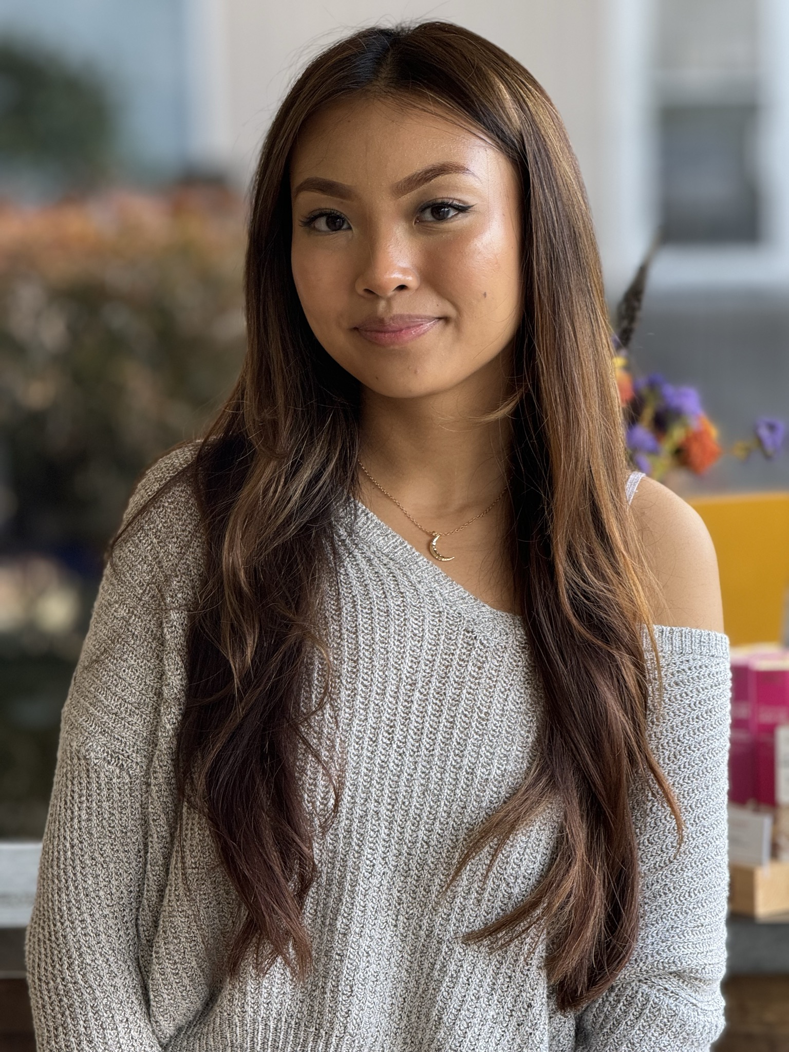 client smiling during a consultation at willow hair, eugene OR